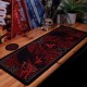 Vade escolar y posavasos Dungeons & Dragons con dragones rojos.