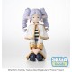 Estatua de Frieren con rizos lilas y atuendo blanco