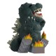 Figura de Godzilla em vinil com edifícios em chamas