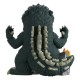 Figura de Godzilla em vinil com edifícios em chamas