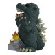Figura de Godzilla em vinil com edifícios em chamas