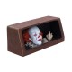 Figurine Pennywise de 'Ça' avec bateau en papier dans égout