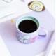 Taza morada BT21 The Journey con personajes animados.