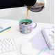 Taza morada BT21 The Journey con personajes animados.
