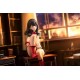 Estátua de Rikka Takarada em uma mesa de Gridman Universe