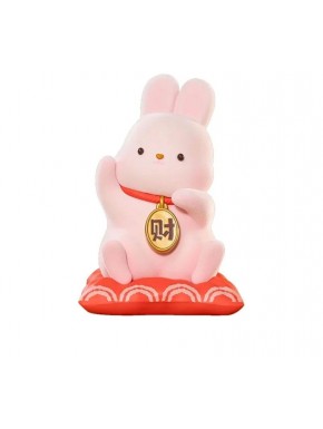Statue rose de Momo Bunny sur coussin rouge