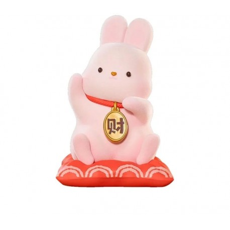 Statue rose de Momo Bunny sur coussin rouge
