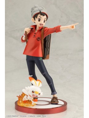 Estatua de Victor y Scorbunny de Pokémon en base roja
