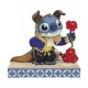 Figura de Stitch como la Bestia con traje azul y flor