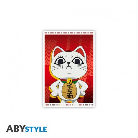 Magnet de Dan da Dan con personaje estilo maneki-neko sobre fondo rojo
