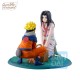 Figura de Naruto Uzumaki y Haku en una pose dinámica