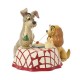 Figurine de La Belle et le Clochard partageant des spaghettis.
