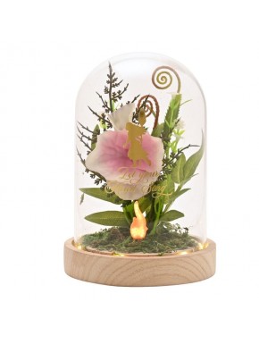 Lampe décorative Moana sous cloche de verre avec fleurs.