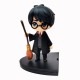 Figurine de Harry Potter avec tampon et balai