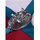 Broche ovalado vikingo de Birka con cabezas de caballo