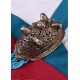 Broche ovalado vikingo de Birka con cabezas de caballo