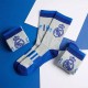 Meias cinzentas e azuis do Real Madrid com emblema